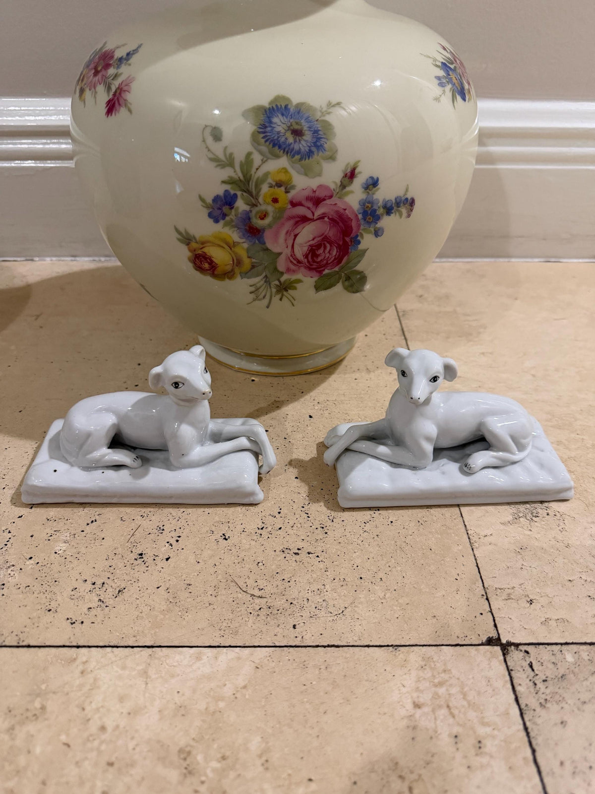 Vintage porcelain staffordshire dog pair sitting on cushions
