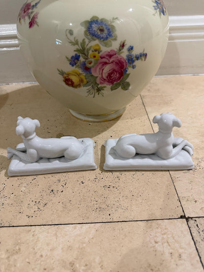 Vintage porcelain staffordshire dog pair sitting on cushions