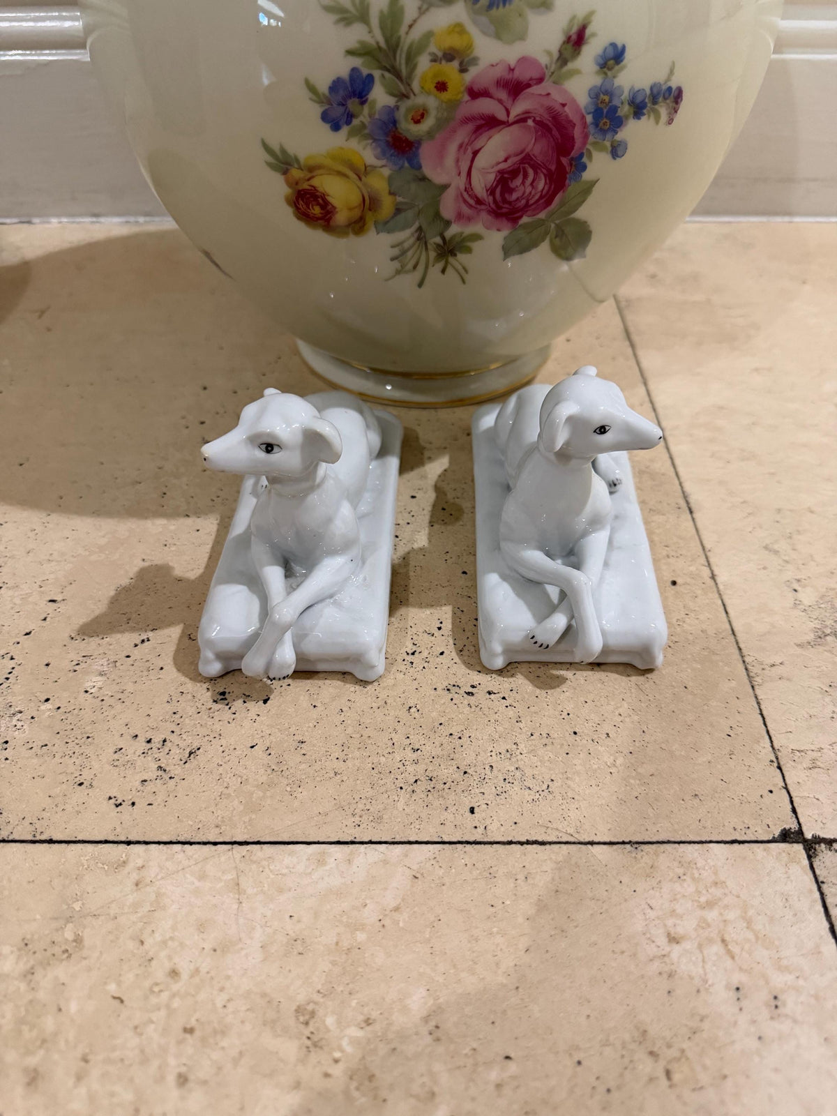 Vintage porcelain staffordshire dog pair sitting on cushions