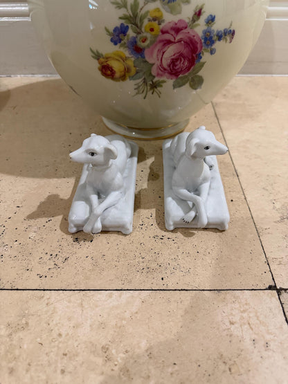 Vintage porcelain staffordshire dog pair sitting on cushions